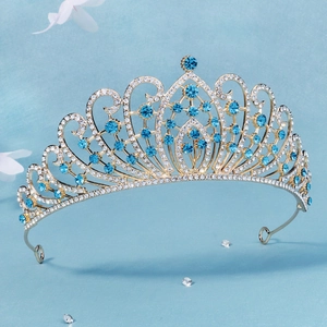 Macro shot of luxury bridal tiara with blue crystals and glittering rhinestones