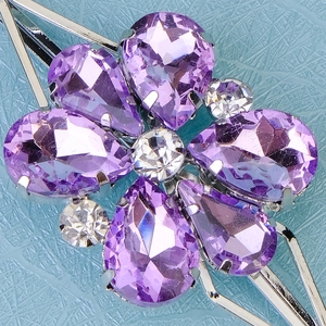 Elegant purple crystal flower hair clip with silver base and pear-shaped rhinestones