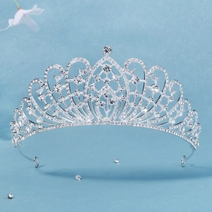 Detailed macro view of luxury silver bridal tiara with intricate sparkling rhinestones
