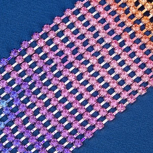 Macro shot of colorful rhinestone tassel hair clip with gradient purple and orange stones