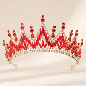 Detailed macro view of the luxury gold crown with red marquise gems and white diamonds