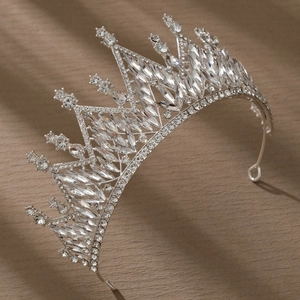 Macro detail of luxury silver bridal crown with intricate crystal and rhinestone settings