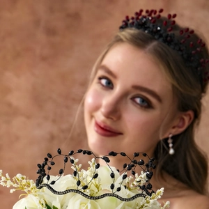 Close-up of handmade beaded crown headband featuring red and black vintage crystal beads