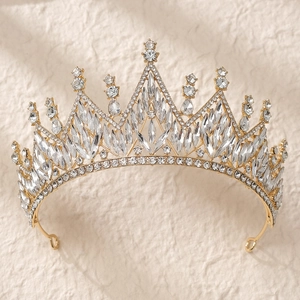 Detailed close-up of a luxury gold bridal crown with marquise and pear-cut crystals