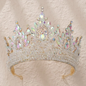 Macro shot of handcrafted bridal crown featuring gold metal frame and waterdrop crystals