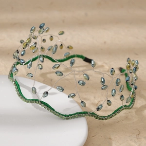 Handmade bohemian crystal crown headband with green rhinestones and blue beads on white base