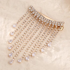 Elegant gold-tone bow hair clip with sparkling rhinestone tassels and pear-shaped drops