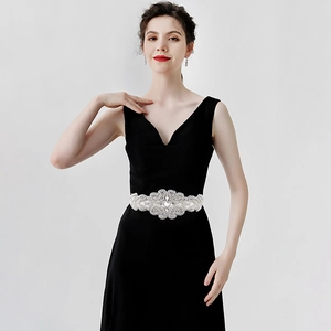 Luxurious silver bridal rhinestone belt with intricate crystal patterns on a black dress