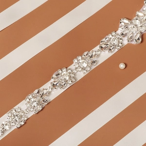 Close-up of sparkling bridal belt with rhinestones and crystals for wedding gowns