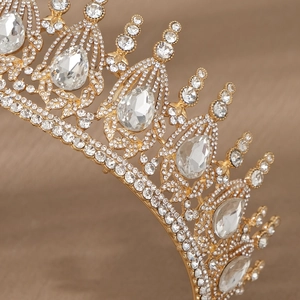 Macro detail of luxury vintage bridal crown with gold metalwork and crystal teardrop stones