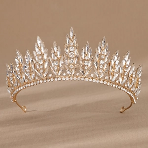 Close-up of golden bridal crown with sparkling clear marquise and round crystals