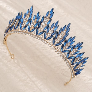 Detailed macro view of bridal crown featuring blue marquise rhinestones and gold base