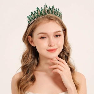 Elegant gold bridal crown with emerald green rhinestones and sparkling crystals