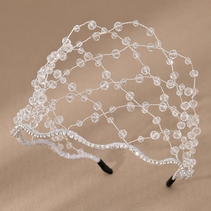 Detail of handcrafted silver wire weaving with clear crystals and sparkling rhinestones