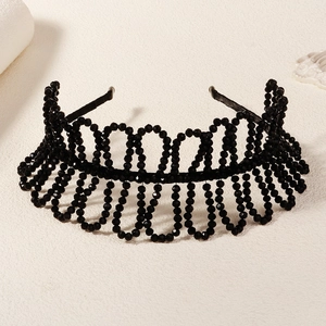 Close-up of black crystal beaded headband with multi-layer wave design for weddings