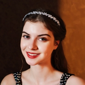 Detailed close-up of a silver crystal headband featuring marquise cut rhinestones