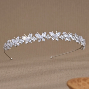 Detailed macro view of silver butterfly headband with sparkling cubic zirconia crystals