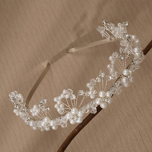 Elegant floral silver headband with white pearls and crystals for wedding hairstyles