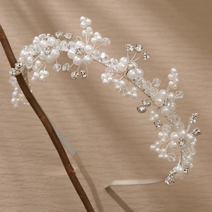 Elegant floral silver bridal hair vine with pearls and crystals for wedding hairstyles