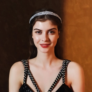 Detail of silver crystal leaf headband on female model with marquise cut sparkling zircons