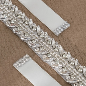 Elegant bridal sash with sparkling crystals and white silk ribbon for wedding dresses