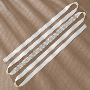 Elegant bridal wedding belt with silver rhinestones and leaf sequins on white satin ribbon