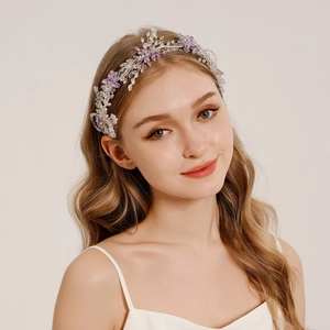 Luxurious bridal headband with purple and white crystals in a floral vine design