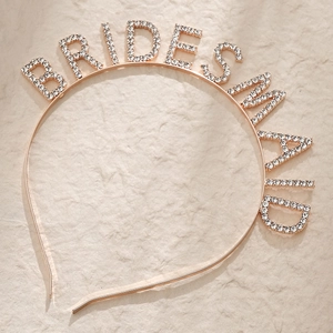 Close-up of bridesmaid headband with sparkling rhinestones on rose gold frame