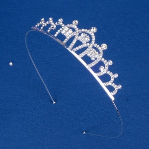 Close-up of a silver rhinestone tiara featuring classic European arch design on blue background