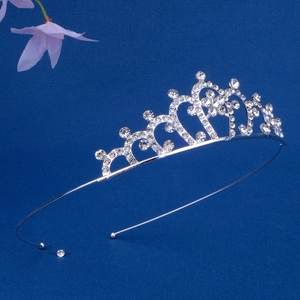 Detail of silver alloy crown headband with heart shapes and sparkling rhinestones
