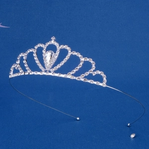 Close-up of silver crystal crown with teardrop rhinestones and a heart-shaped design