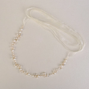 Detailed close-up of handmade pearl waist chain with crystals and elegant chiffon ribbons