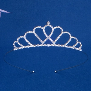 Close-up of heart-shaped silver crown headband with sparkling rhinestones for girls