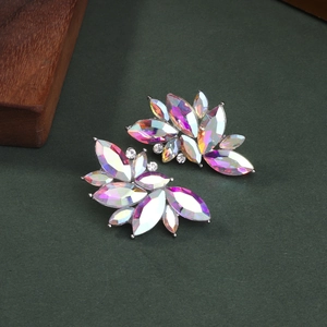 Luxurious iridescent crystal leaf earrings with marquise cut stones on dark green background