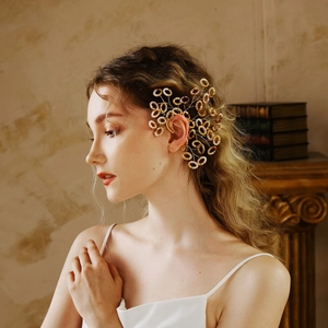 Artistic amber ring ear cuff with a radiant coral-inspired design for high-end fashion