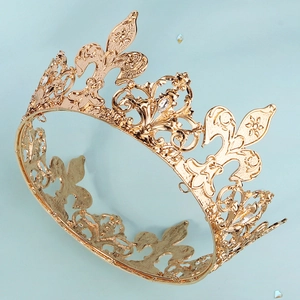 Detailed macro view of golden rhinestone tiara with elegant fleur-de-lis hollow metal patterns