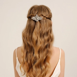 Detailed view of luxury silver hair clip with sparkling rhinestones on bridal hair style