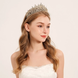 Detailed view of luxury bridal crown with brilliant rhinestones and intricate gold filigree