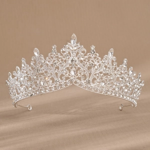 Detailed macro shot of silver bridal crown with shimmering rhinestones and secure end loops