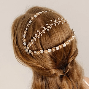 Vintage Chinese bridal floral headband with pearls and gold wire on braided hair
