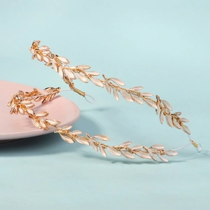 Detail of Greek goddess style golden leaf headband with white enamel coating and metal wire