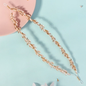 Elegant gold leaf headband accessory for bridal wedding hairstyles with white ribbon tie