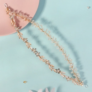 Elegant gold flower headband with white pearls and sparkling rhinestones for bridal hair