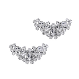 Detailed macro view of fan-shaped silver alloy shoe clips with sparkling rhinestones