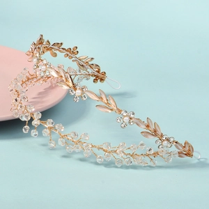 Handmade bridal hair vine with crystal beads, pearls and white enamel leaves on gold wire