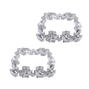 Close-up of two sparkling crystal rhinestone clips for bridal shoes and elegant high heels