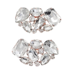 Macro shot of elegant silver alloy shoe clips with sparkling crystal rhinestones for bridal heels