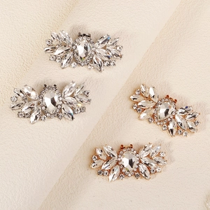 Sparkling crystal shoe clips in silver and gold petal design for wedding bridal heels
