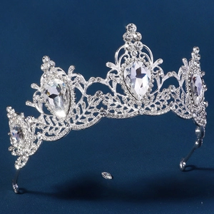 Close-up of silver baroque bridal crown with sparkling rhinestones and pear-cut crystals