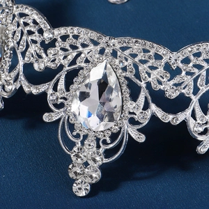 Macro shot of silver baroque crown showing teardrop zircon and pavé rhinestones